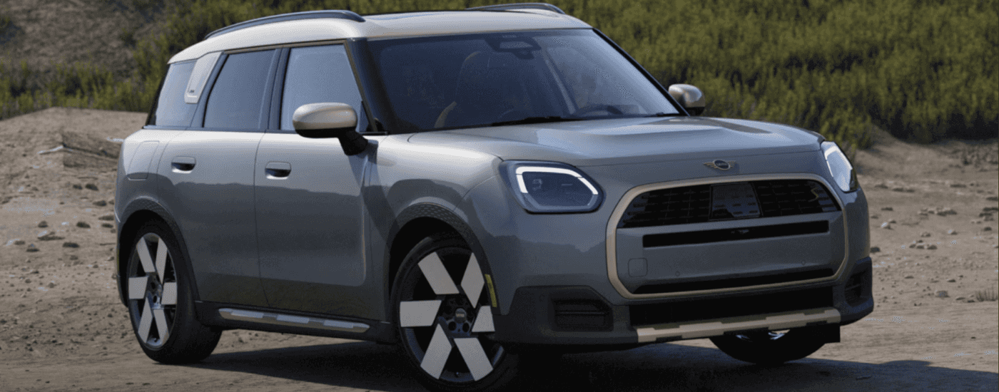 A silver 2025 MINI Countryman parked on sand