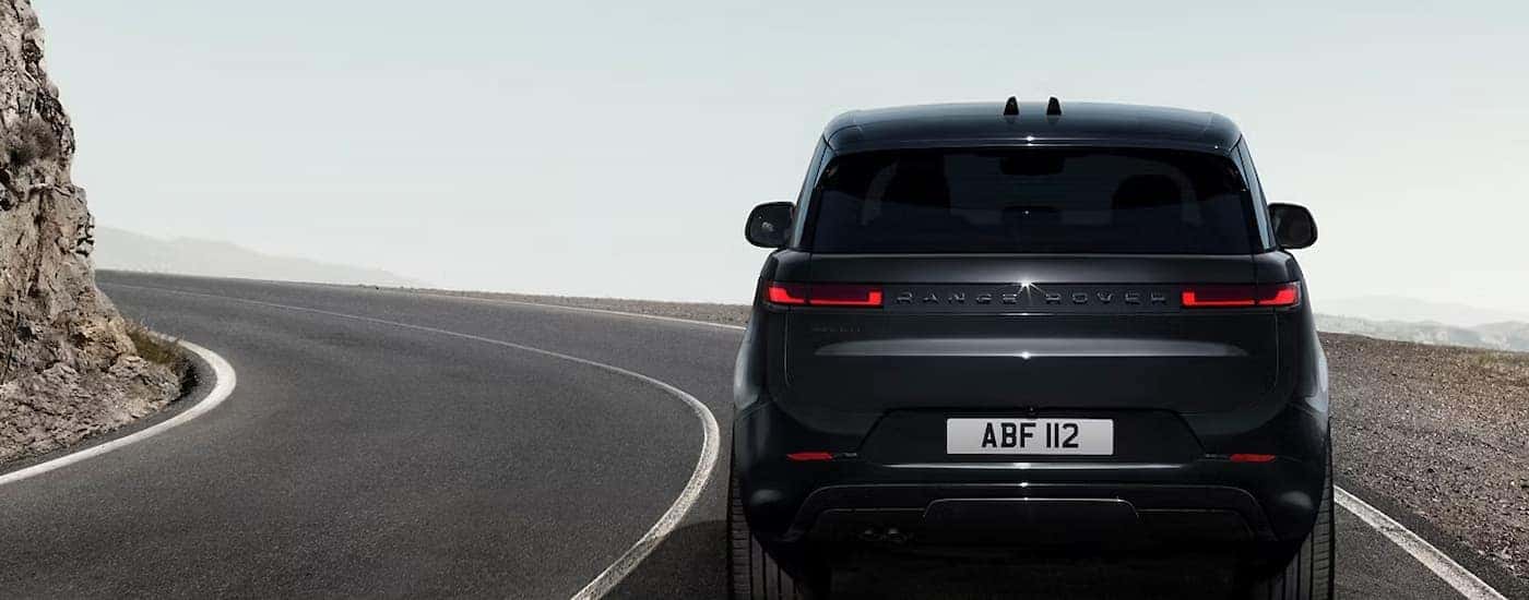 A black 2025 Range Rover Sport driving on a highway