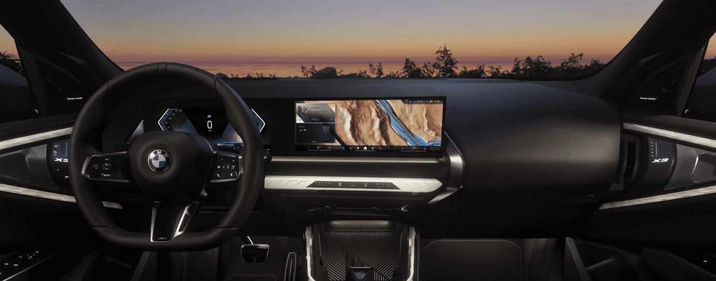 Black interior, digital gauge cluster, and infotainment system on a 2025 BMW X3
