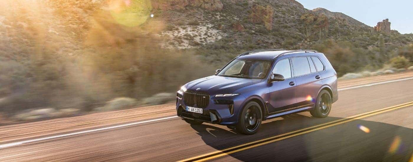 A blue 2025 BMW X7 for sale from the front.