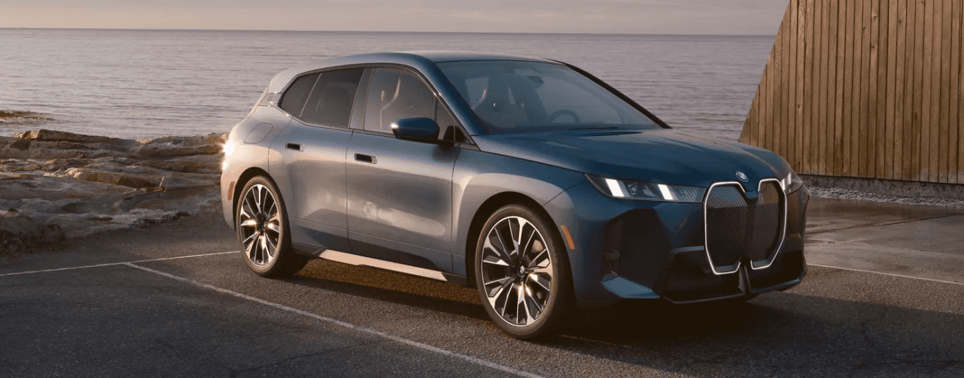 Grey 2026 BMW iX for sale parked after a test drive