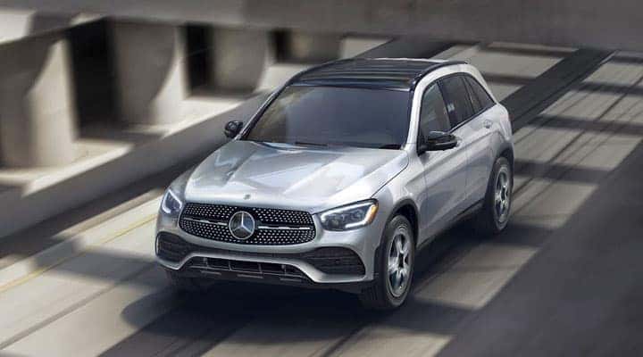 Silver Mercedes-Benz SUV driving on a bridge
