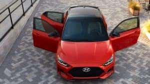 2021 Hyundai Veloster in red with doors open.