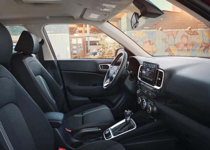 black interior of an suv viewing the front drivers area