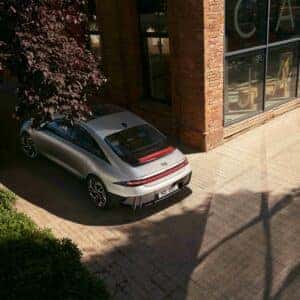 rear view of a car parked next to a building