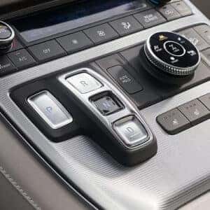 Close-up of the electronic gear shift buttons and climate control system in the 2023 Hyundai Palisade.