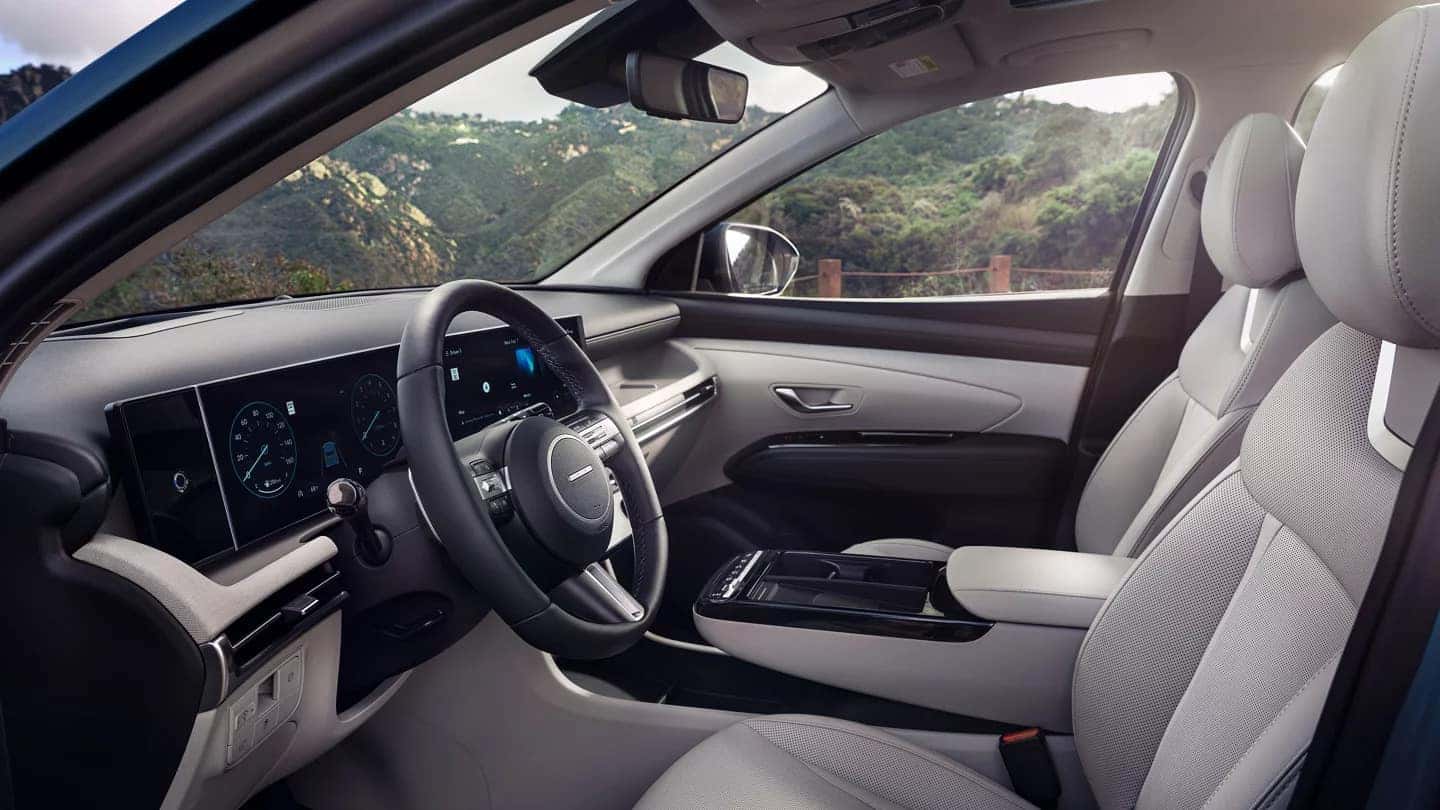 Side profile of the 2025 Hyundai Tucson’s interior, displaying its comfortable seating, high-tech features, and premium materials.