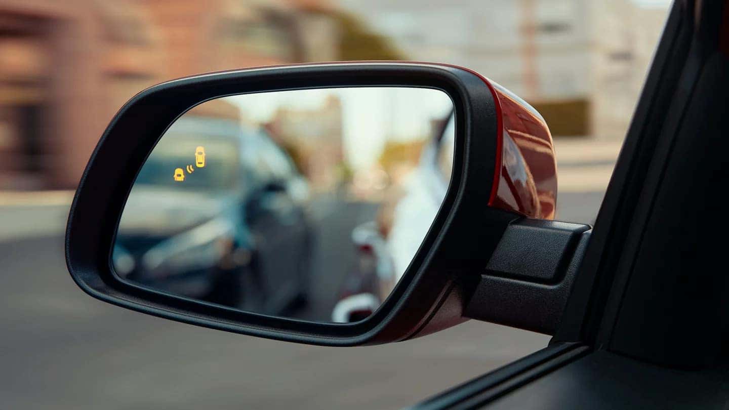 depiction of blindspot monitoring in the side mirror of a hyundai venue