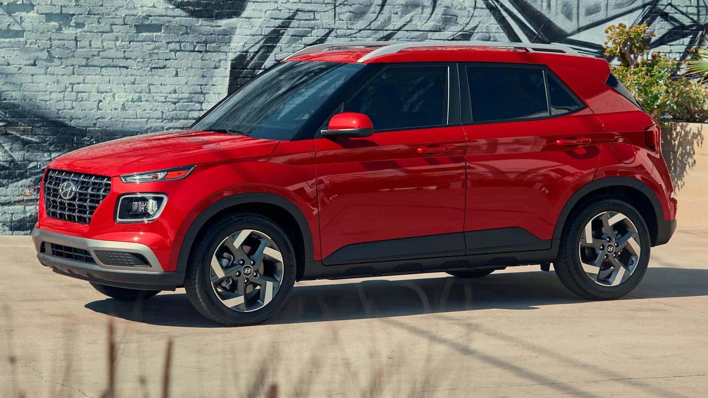 side profile of a red 2025 hyundai venue 