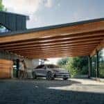 A Hyundai IONIQ 6 parked underneath an outdoor garage