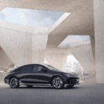 Black 2023 Hyundai IONQI 6 parked under modern architecture