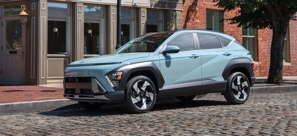 2025 Hyundai KONA parked in front of a brick building