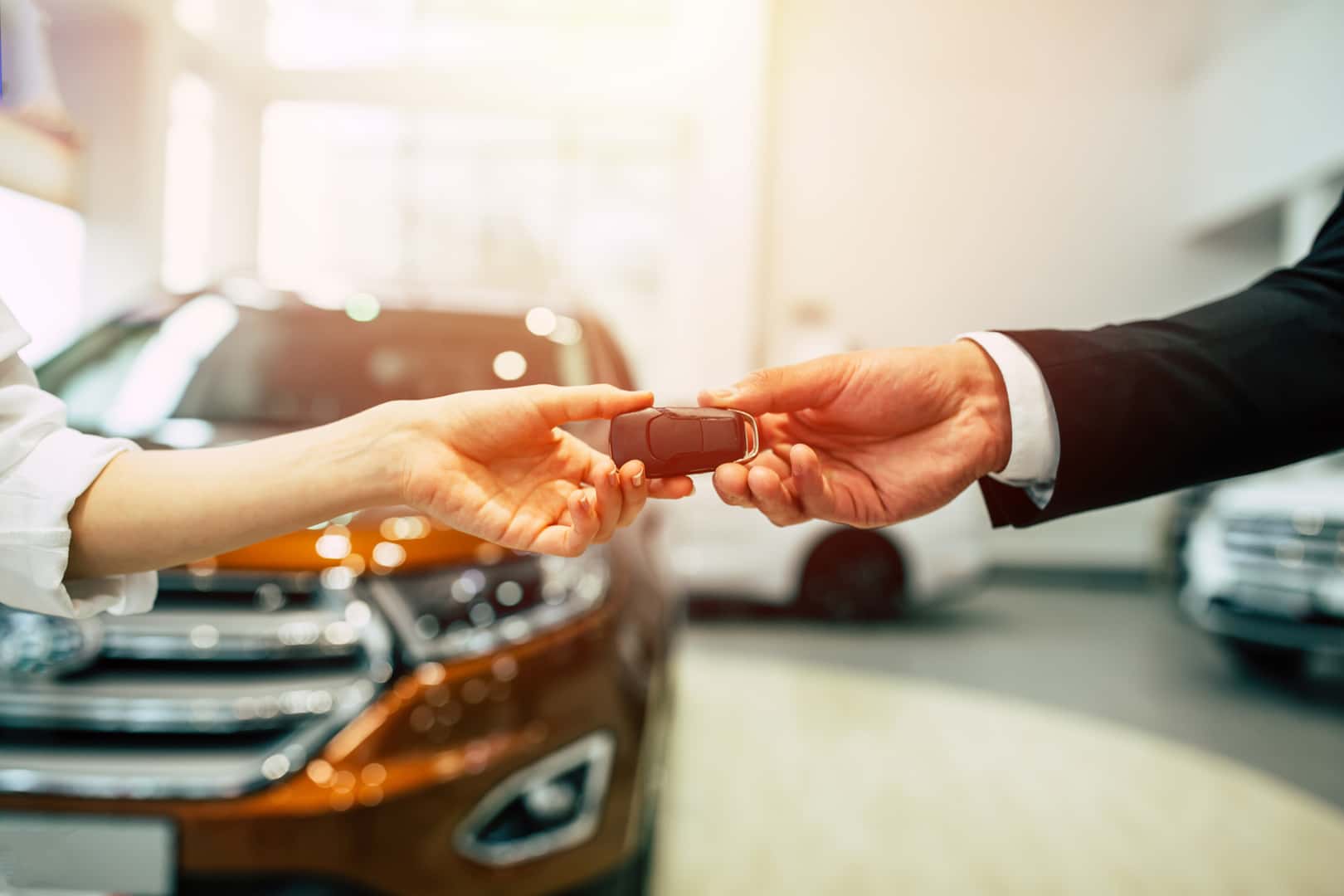 Passing car keys into new owner's hands