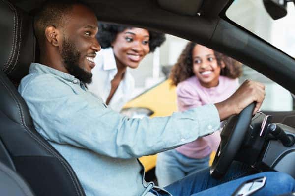 Family in new car