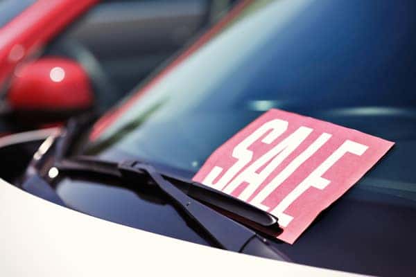 Car with a Sale sign in the window