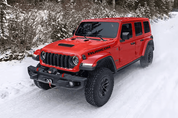 red jeep wrangler in snow