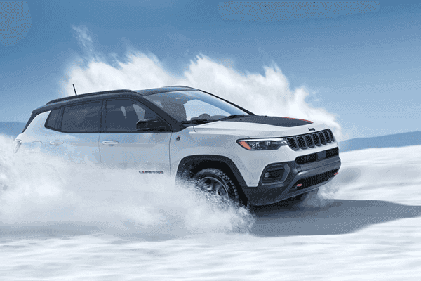 jeep cherokee driving through snow
