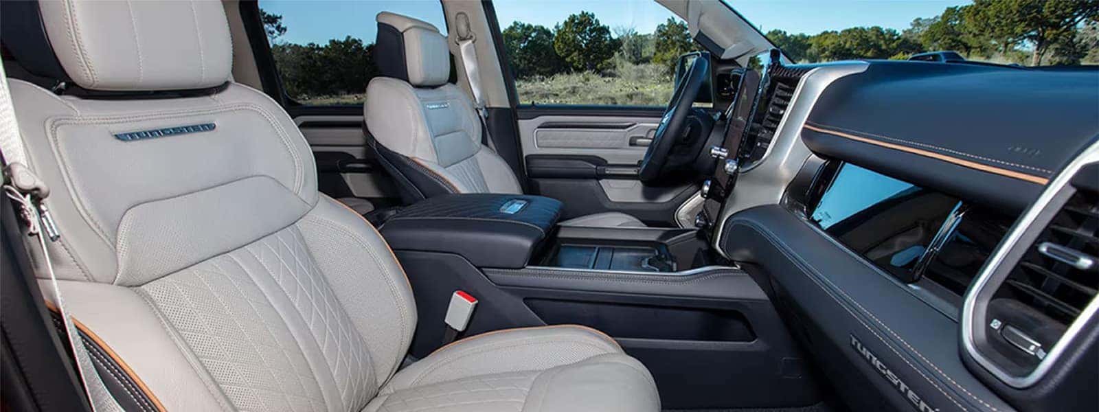 Cabin view with Uconnect 5 touchscreen and premium seats in the 2025 Ram 1500
