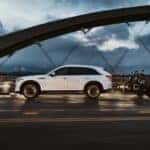 White 2025 Mazda CX-90 towing motorcycles