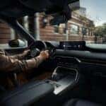 woman driving 2026 mazda cx-90