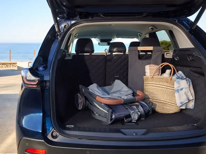 Open cargo area of the 2026 Mazda CX-5 showing 33.7 cubic feet of space behind the rear seats, at Sport Mazda North Longwood