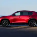 Side profile of the redesigned 2026 Mazda CX-5 showing its longer wheelbase, at Sport Mazda North in Longwood, Florida