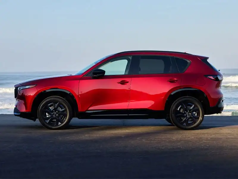 Side profile of the redesigned 2026 Mazda CX-5 showing its longer wheelbase, at Sport Mazda North in Longwood, Florida