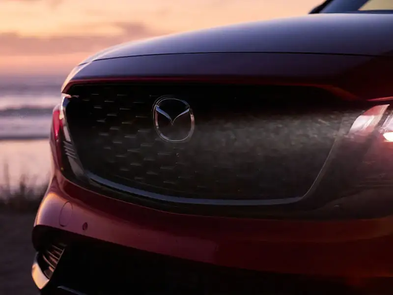 Front grille and signature wing detail of the 2026 Mazda CX-5 at Sport Mazda North in Longwood, Florida