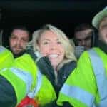 A girl and group of boys taking selfie.