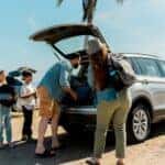 Family loading luggage into an SUV, demonstrating practical cargo space
