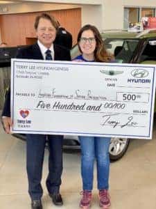 woman holding giant check