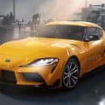 Yellow Supra in garage