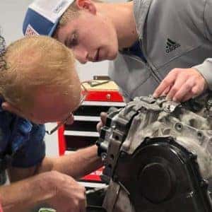 Kids Being Taught Car Mechanics